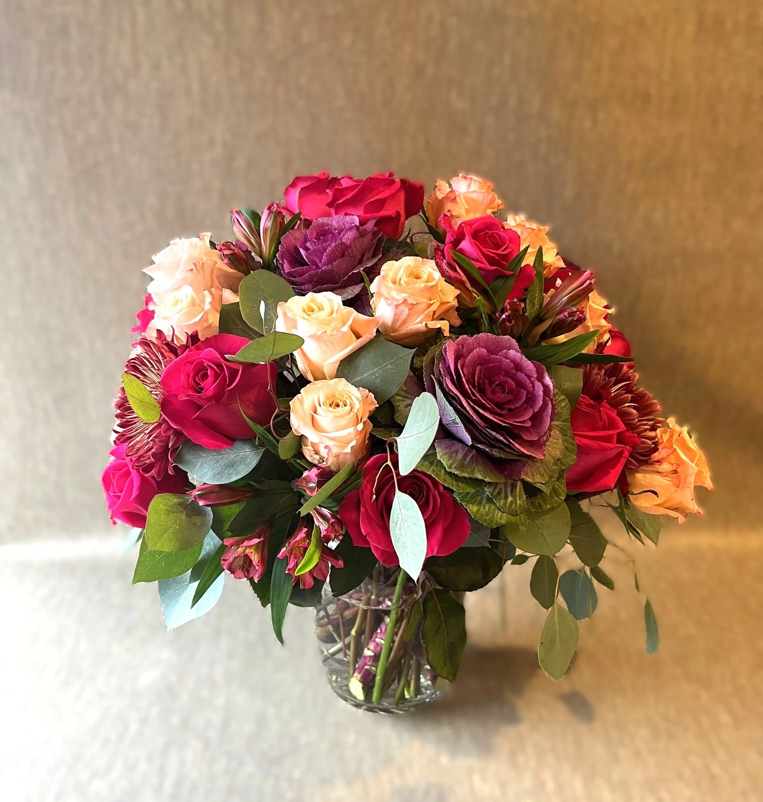Lush flower arrangement, full in style, with unique flowers